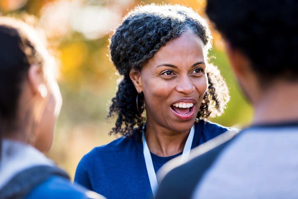 Female coach encouraging athletes